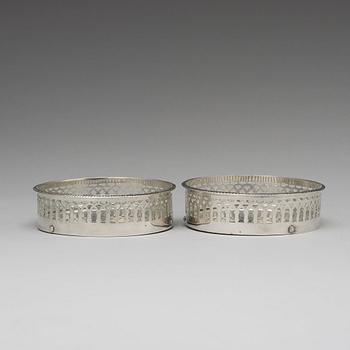 A matched pair of Swedish silver coasters, mark of Gustaf Folcker, Stockholm 1819 and 1826.