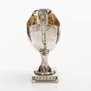 A Swedish Gustavian parcel-gilt silver sauce jug, mark of Daniel Hallman, Stockholm 1810.