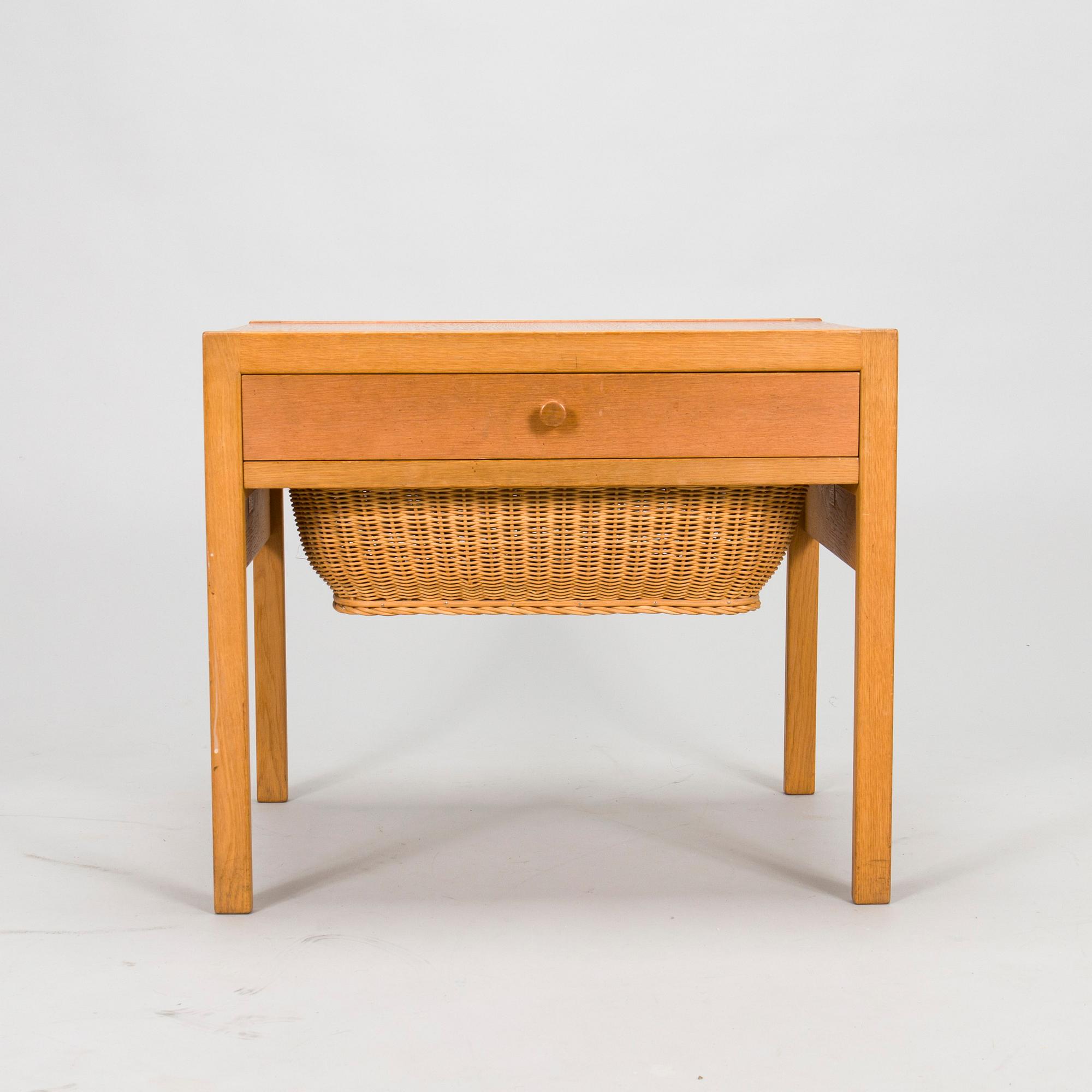 A mid-20th-century sewing table.