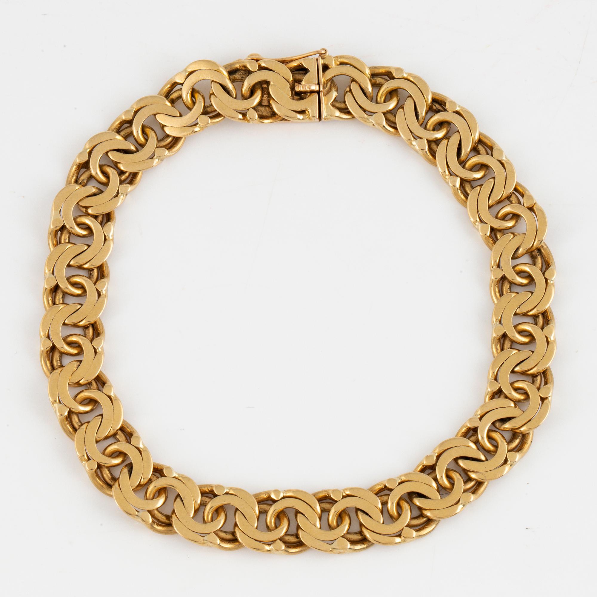 An 18K gold bracelet.