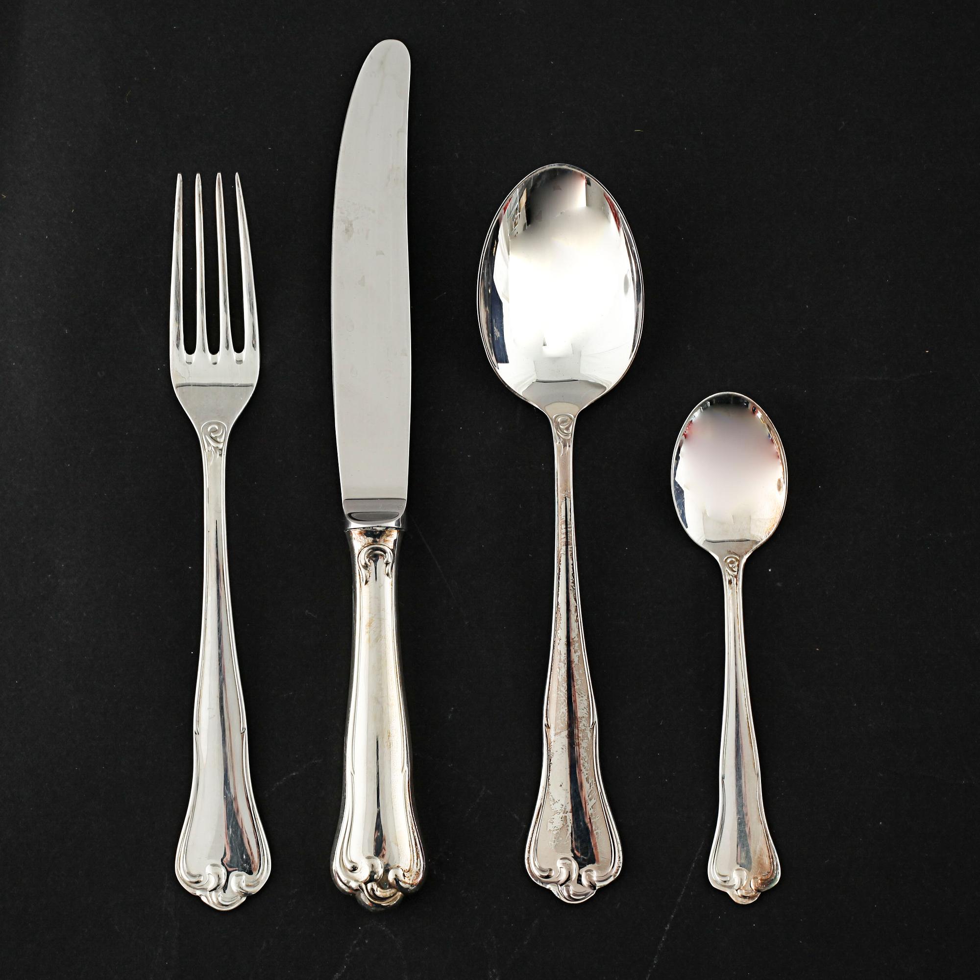 A silver set of table ware of 47 pcs by MEMA, from the late 20th century.