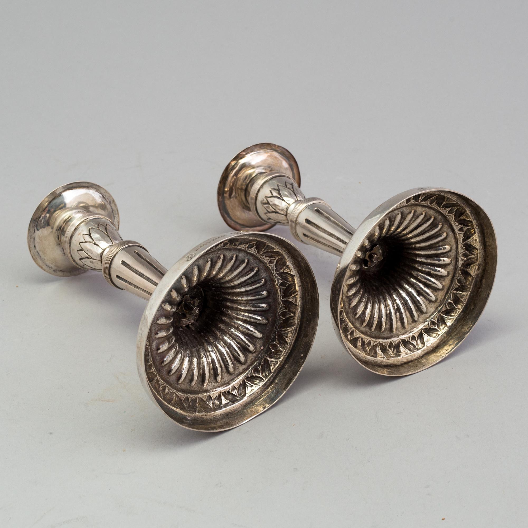 A pair of late 18th century silver candlesticks with unclear hallmarks, possibly from Germany. Weight ca 316 grams.