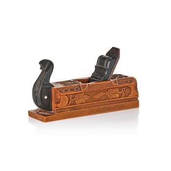 191. A Swedish carved ebony, boxwood and bone plane, dated 1748.