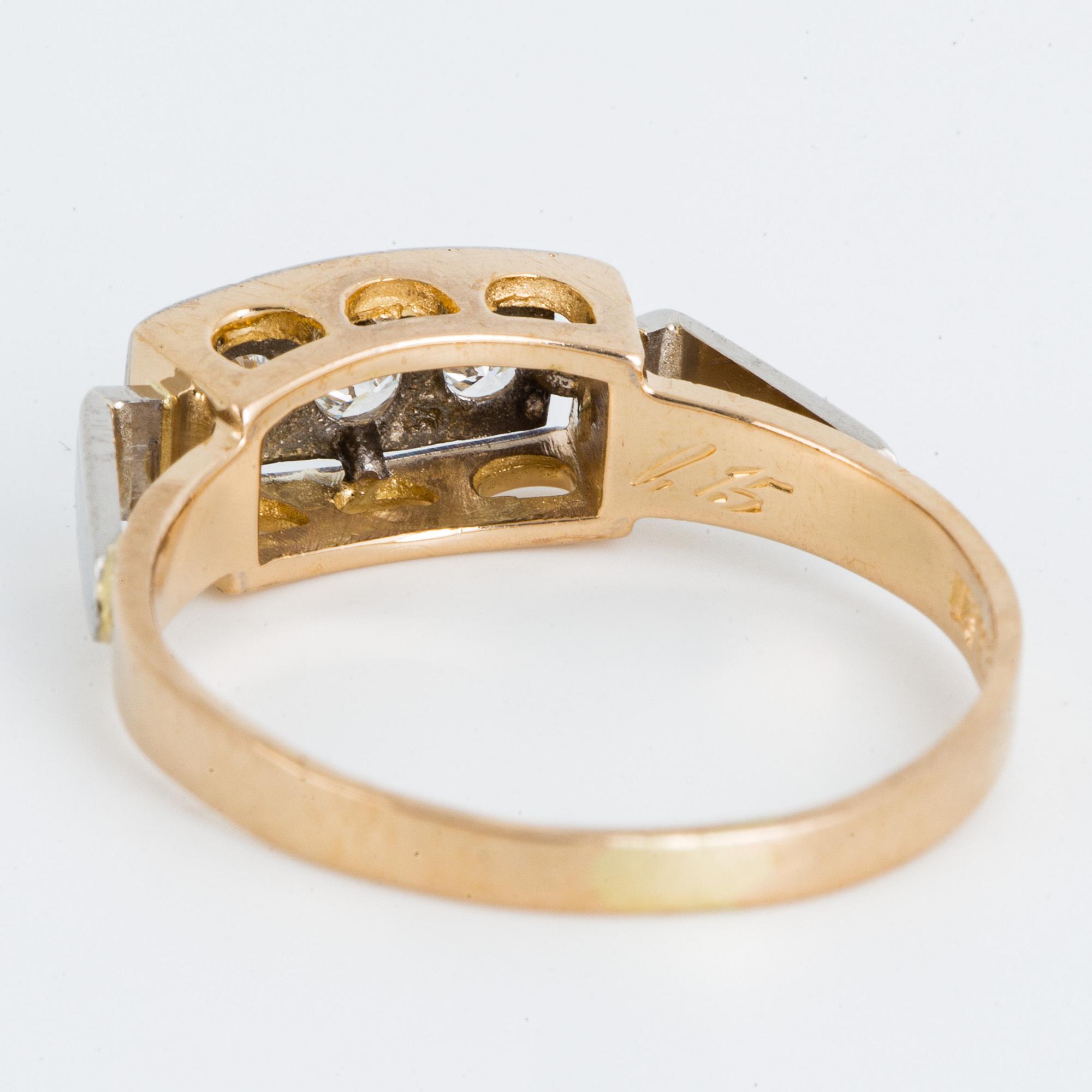 18K gold and brilliant-cut diamond three-stone ring.