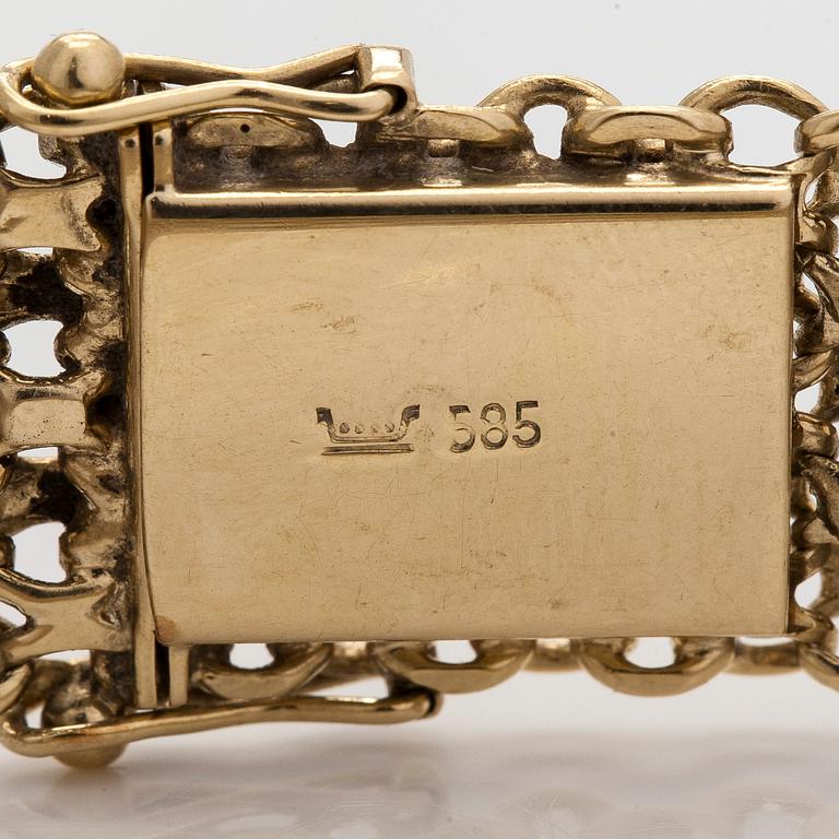 A 14K gold X-link bracelet, likely Norway.