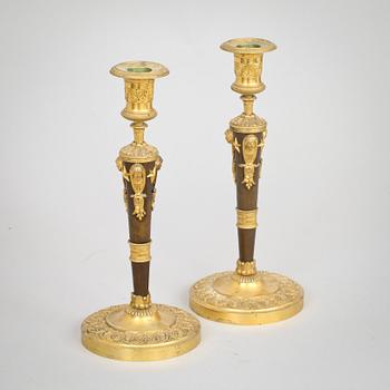 A pair of Empire early 19th century candlesticks.