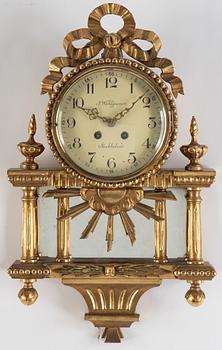 A 20th century gustavian style wall clock.