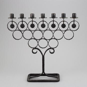A cast iron candelabra by Bertil Vallien for Kosta Smide, Sweden.
