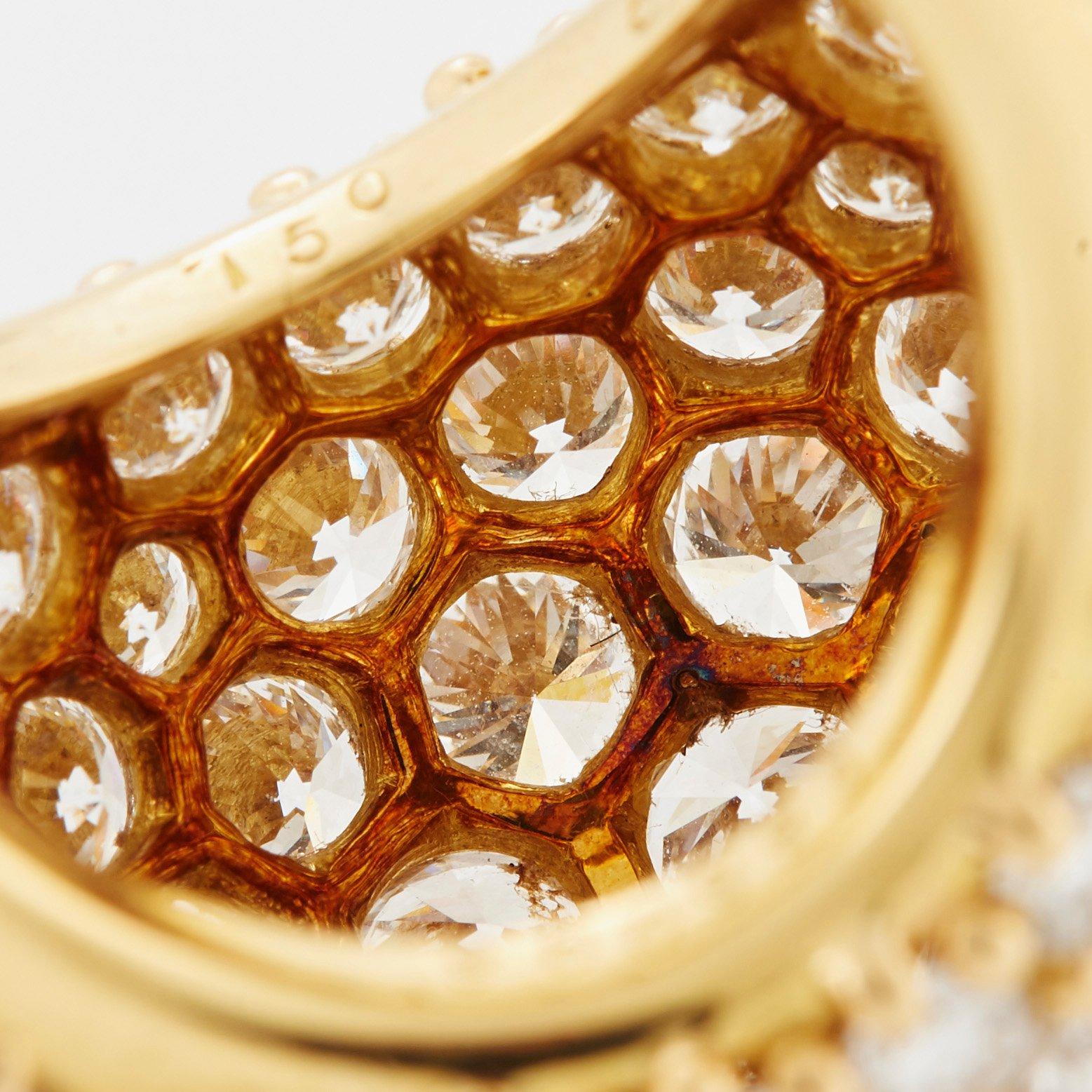 Cartier "Marrakech" an 18K gold bombé ring set with round brilliant-cut diamonds.