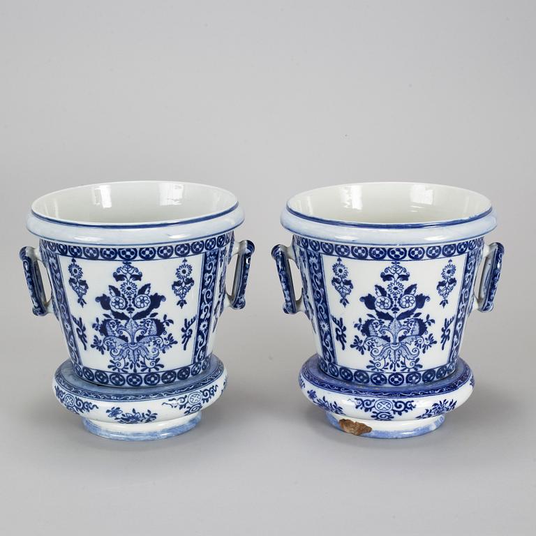 A pair of Petrus Regout & Co, Maastricht pots with bases, Delft, 20th century.