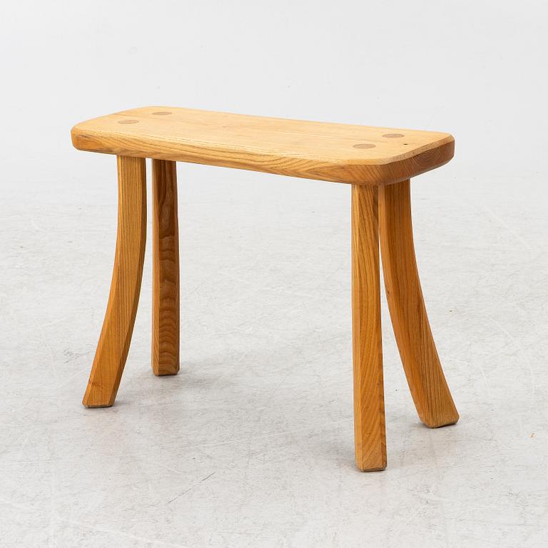 A solid pine stool, signed RO -99, Sweden.