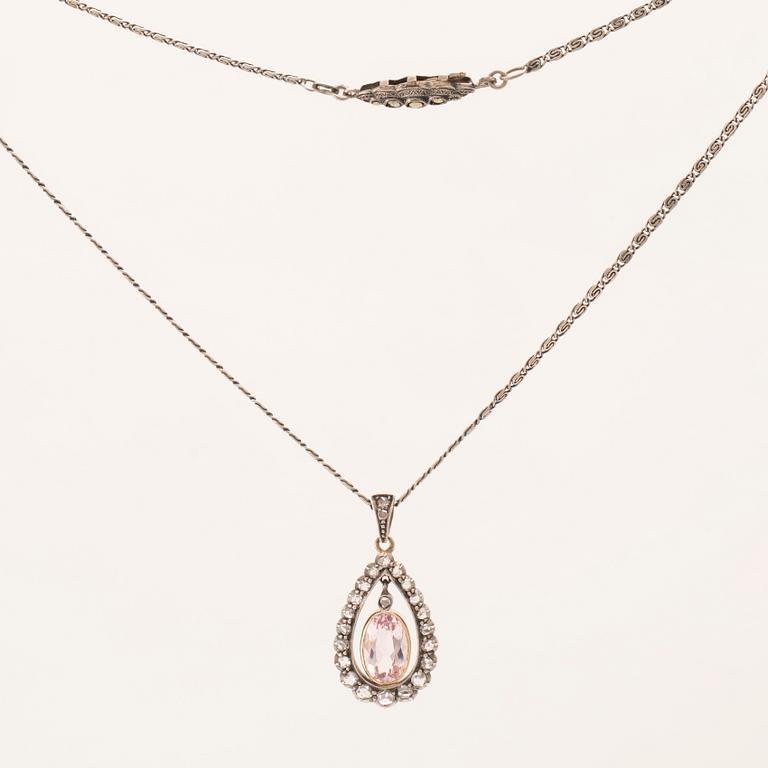 An 18K gold and silver necklace set with an oval faceted morganite and rose-cut diamonds.