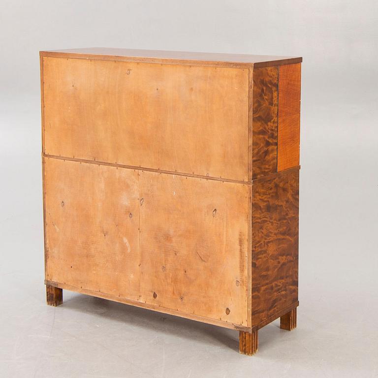 A 1930s birch bar cabinet.