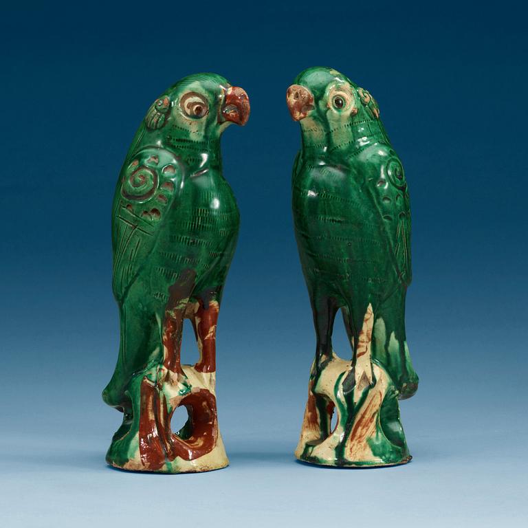 A set of two green glazed falcons, China.