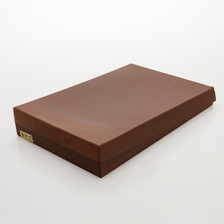 Louis Vuitton, a shimmer 'Halo' bag.