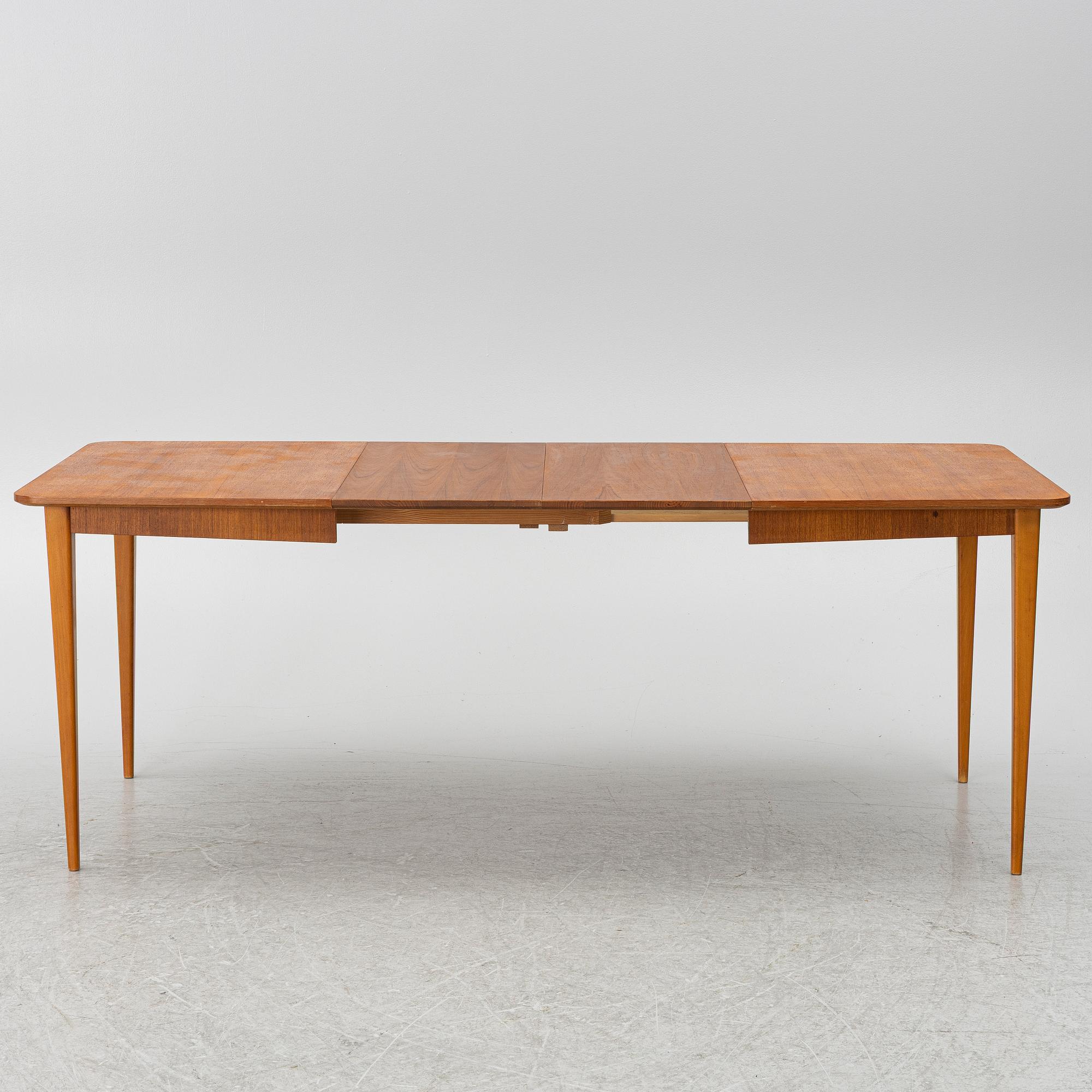 A mid20th century dining table.
