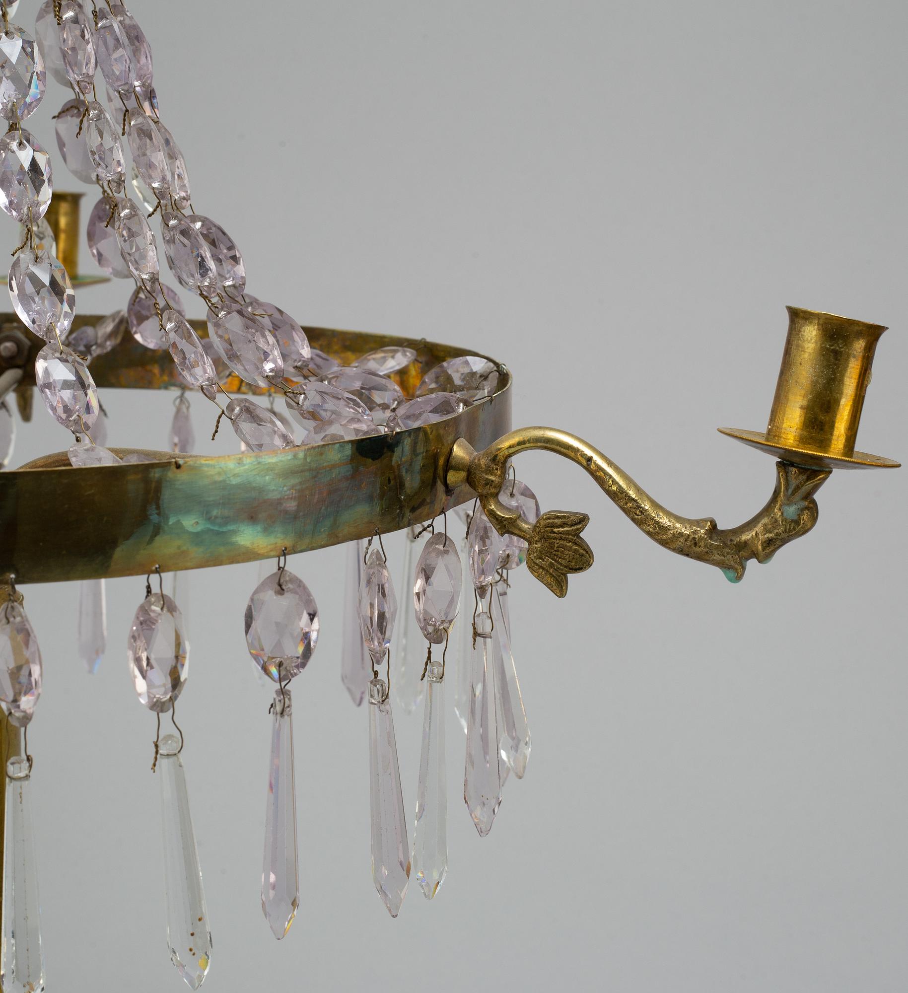 A pair of late Gustavian style three-light candelabra.
