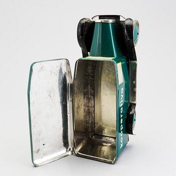 A tinplate biscuit jar in the shape of a truck 1930s.