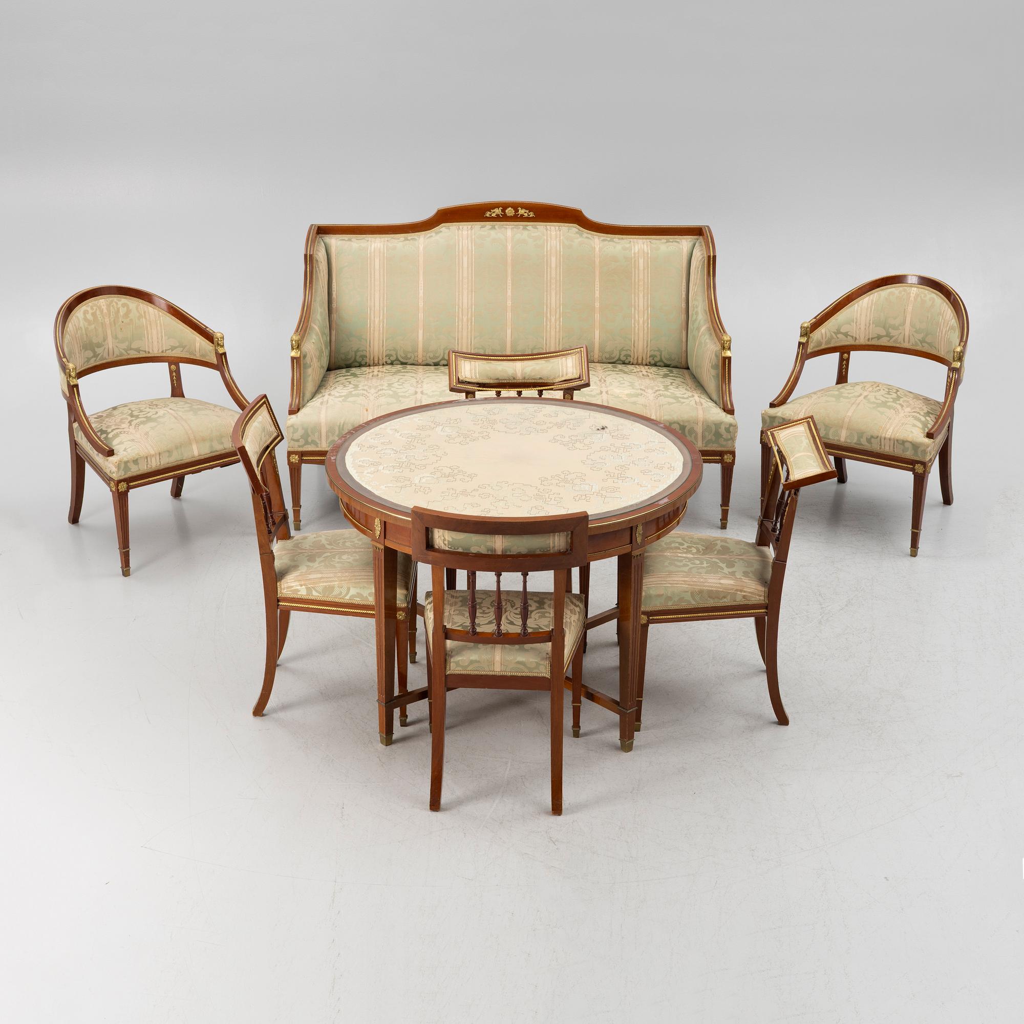 A sofa, two armchairs, four chairs and table, Empire style, 20th century.