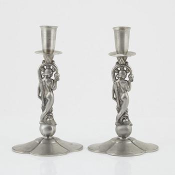A pair of Swedish Grace candlesticks, bearing the mark of CG Hallberg, Stockholm, 1932.