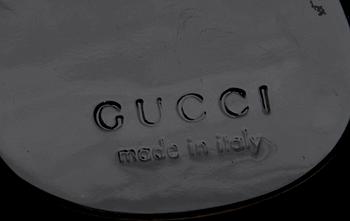 A black monogram suede handbag by Gucci, fall/winter 1997, The Tom Ford collection.