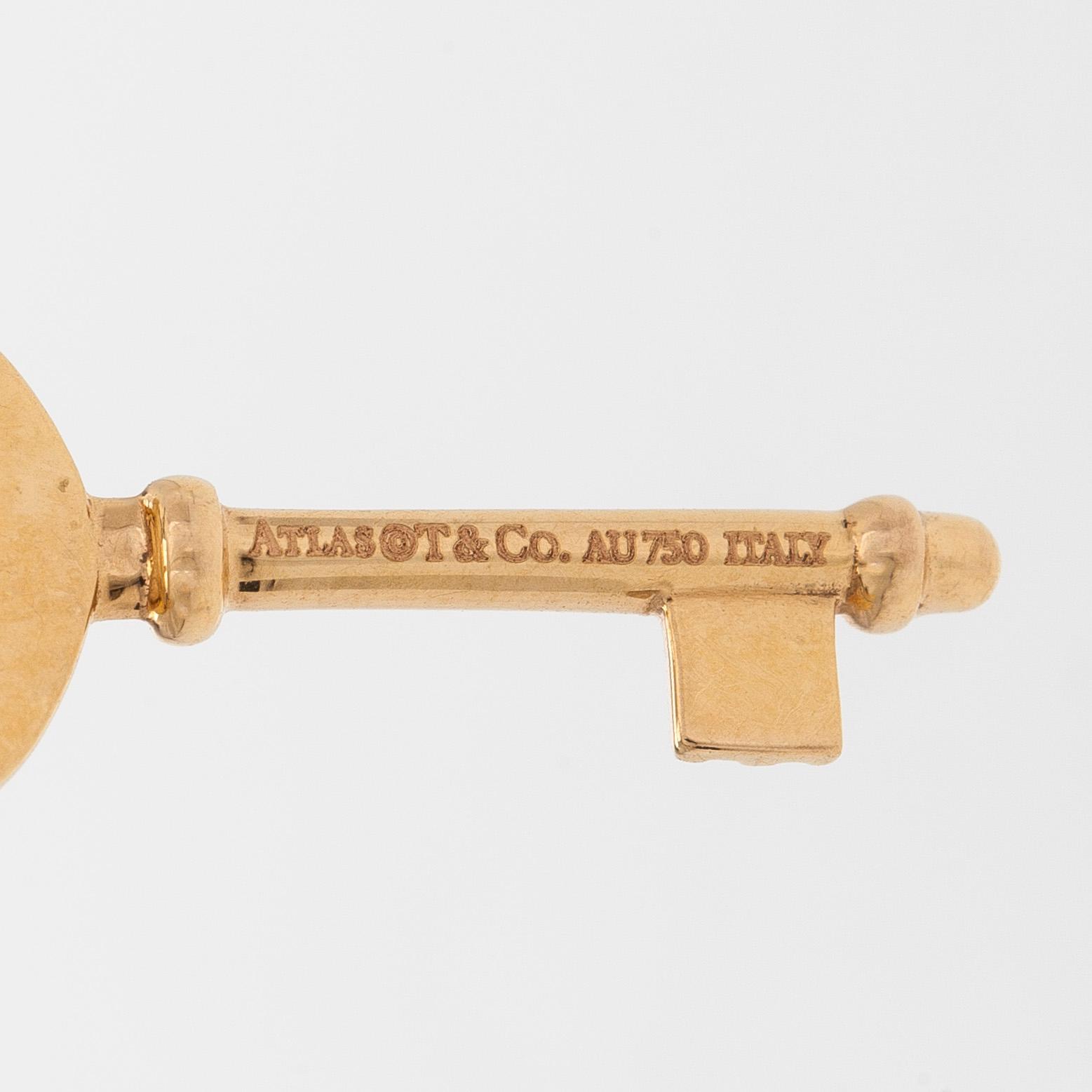 Tiffany & Co, an 18K gold 'Atlas Key' pendant with chain.
