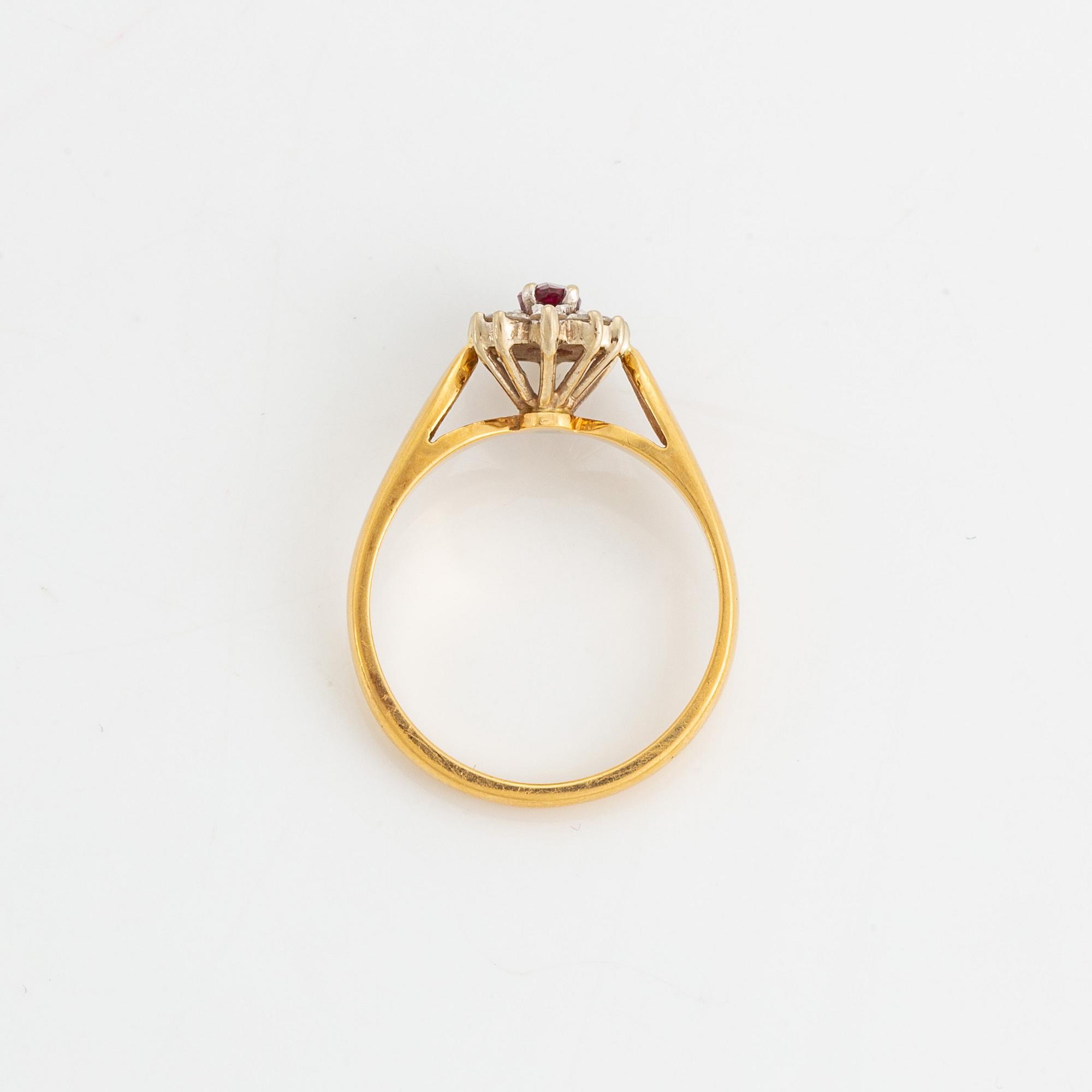 Navette cut ruby and brilliant cut diamond ring.