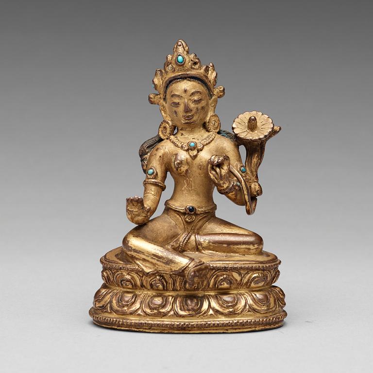 A Tibetan gilt copper alloy figure of Tara, 18th Century or older.