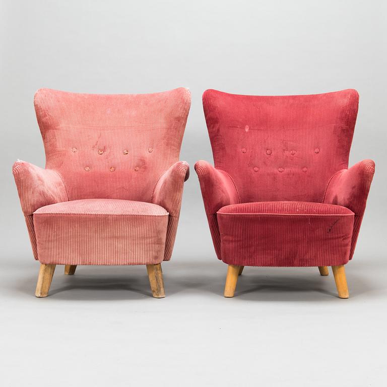 A pair of mid-20th-century armchairs.