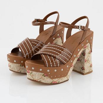 Prada, a pair of embroidered textile and leather sandals, size 37.