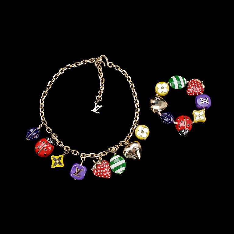 A necklace and a bracelet by Louis Vuitton.
