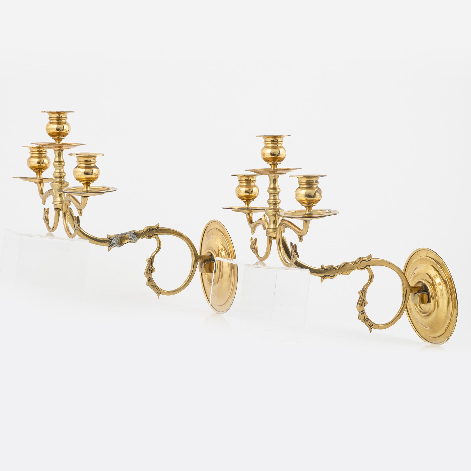 A pair of brass wall sconces, first half of the 20th Century.