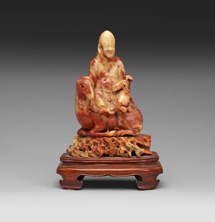 A soapstone figurine of Shoulao, Qing dynasty (1644-1912).