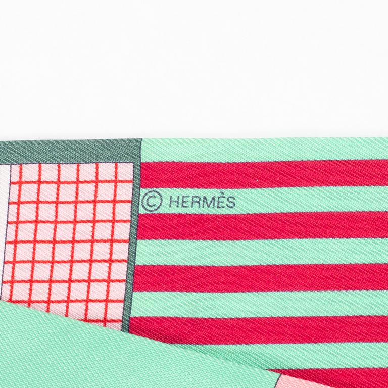 Hermès, a 'Twilly' scarf.