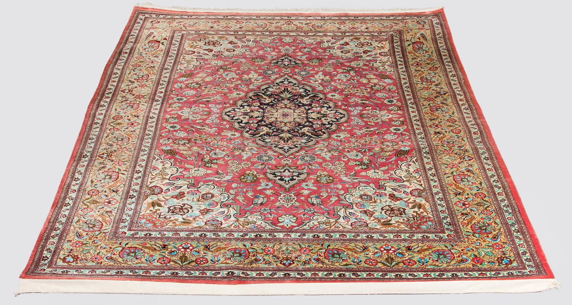 A silk Qum rug, central Persia, approx. 232 x 137 cm.
