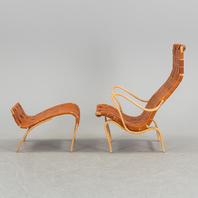 An easy chair with stool by Bruno Mathson.