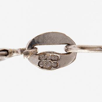 Kaulakoru, 18K valkokultaa ja timantteja n. 0.56 ct yht.