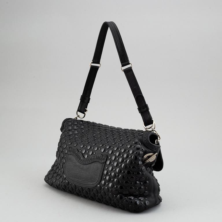 SONIA RYKIEL, a black leather bag.