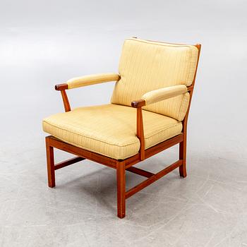 A Josef Frank walnut armchair Firma Svenskt Tenn model nr 667.