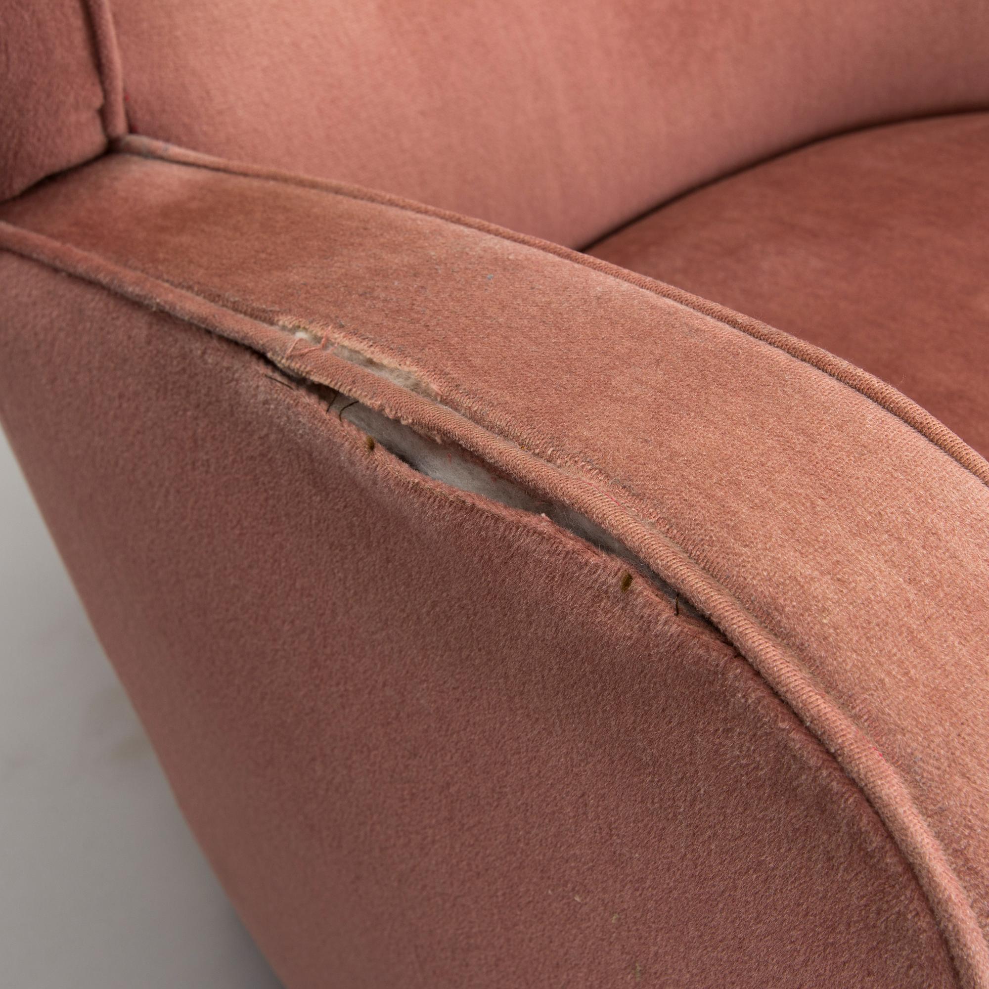 A pair of mid-20th century armchairs.