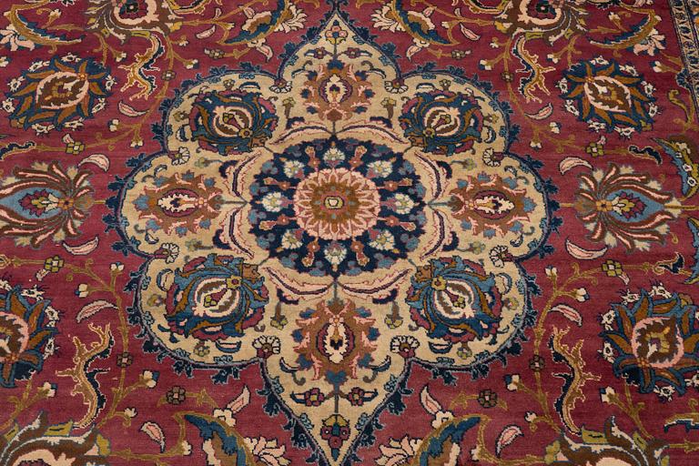 A carpet, semi-antique Tabriz, ca 357,5 x 256 cm.