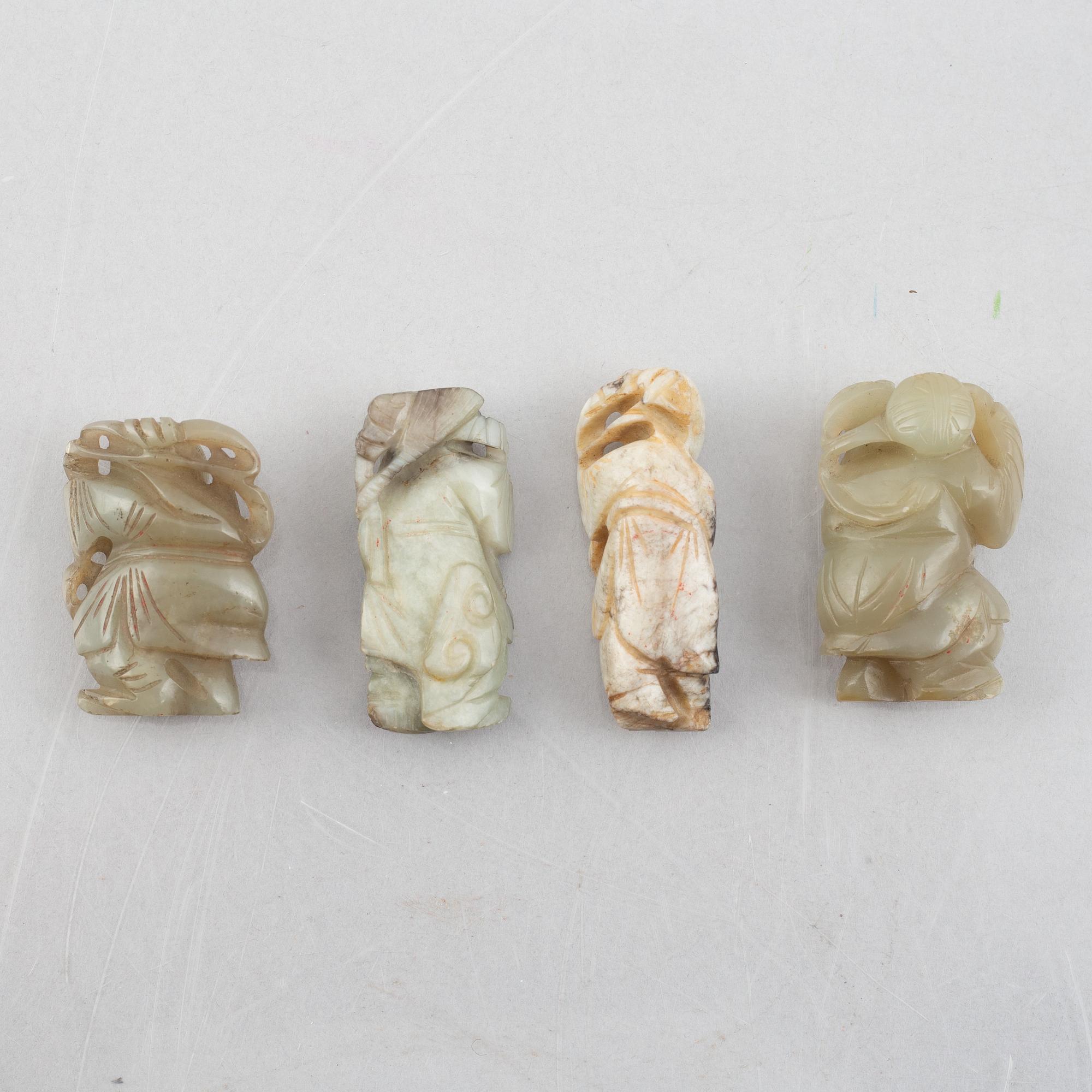A group of four Chinese stone charms, 20th century.