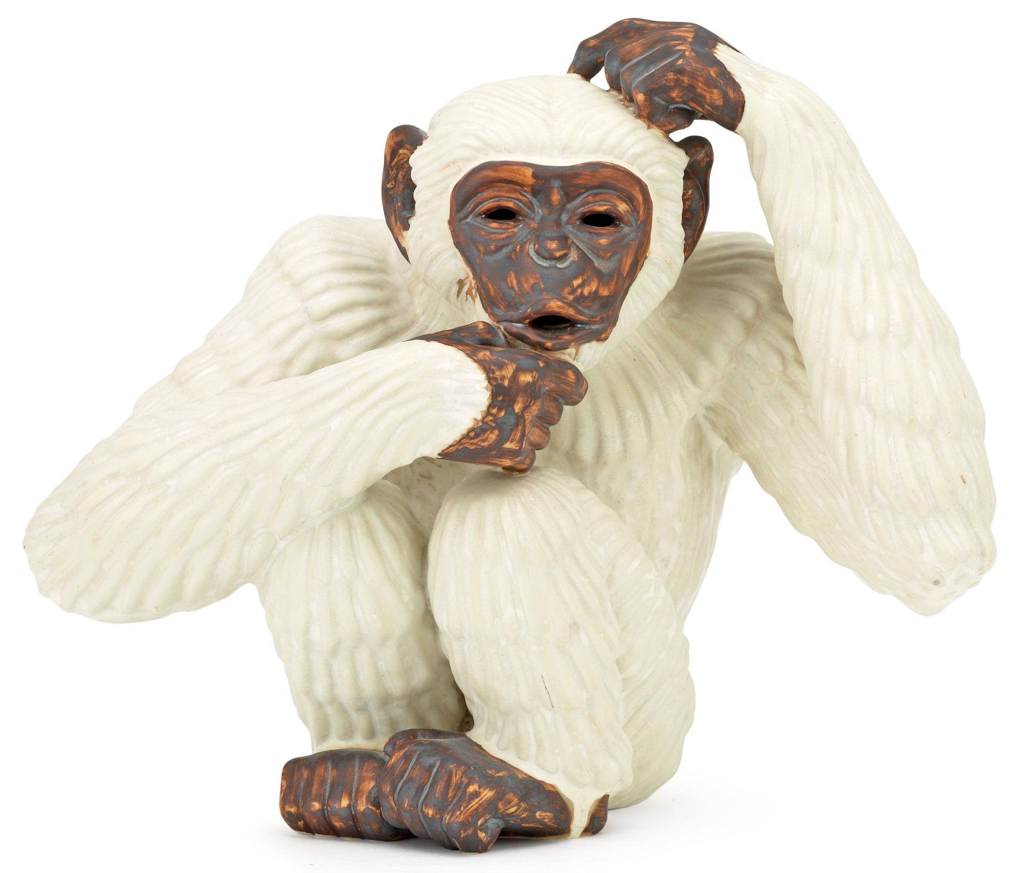A Gunnar Nylund stoneware figure of a chimpanzee, Rörstrand.