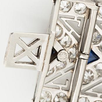 A platinum bracelet with old-cut diamonds and sapphires, likely Bucherer.