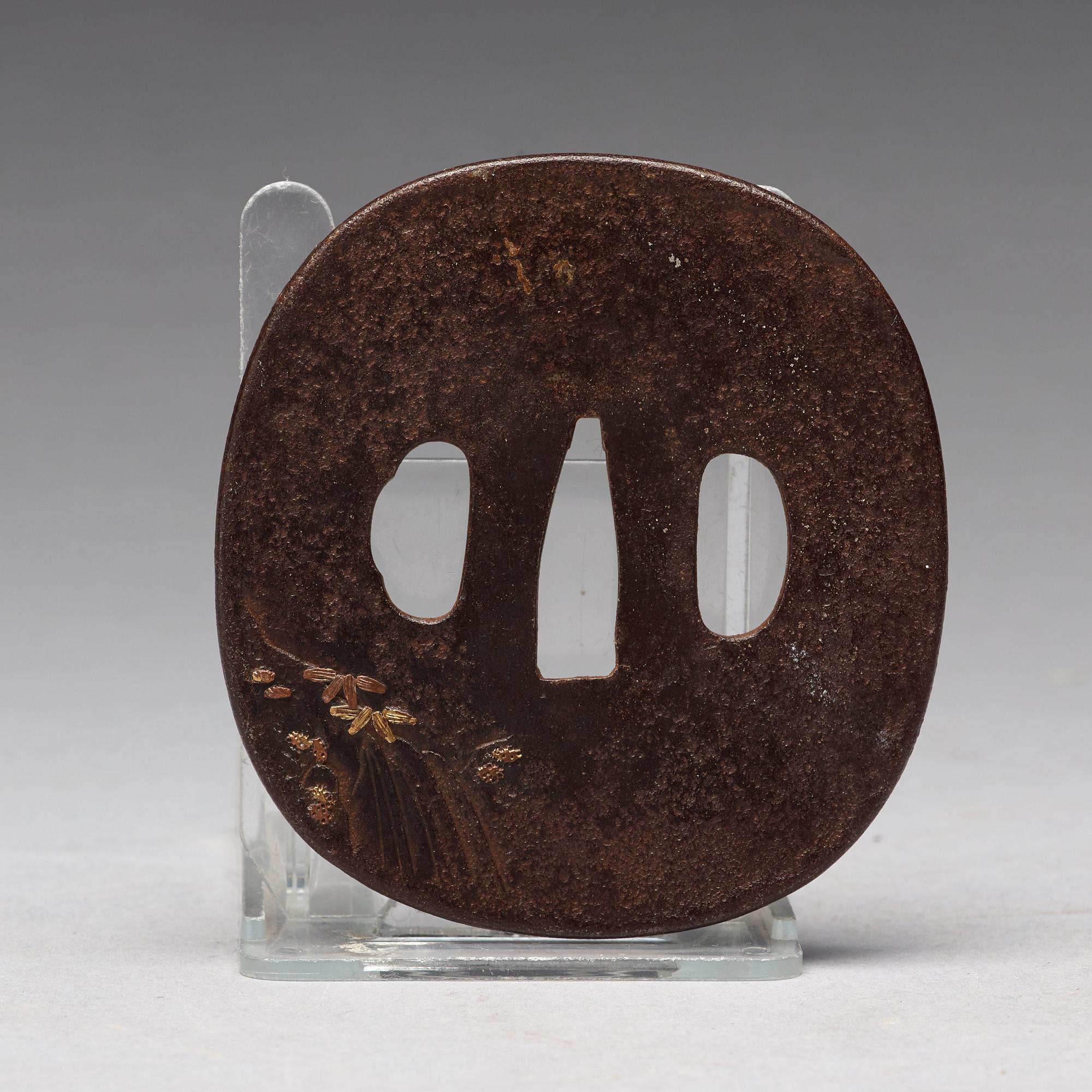 A Japanese bronze Tsuba, Edo period (1603-1868).