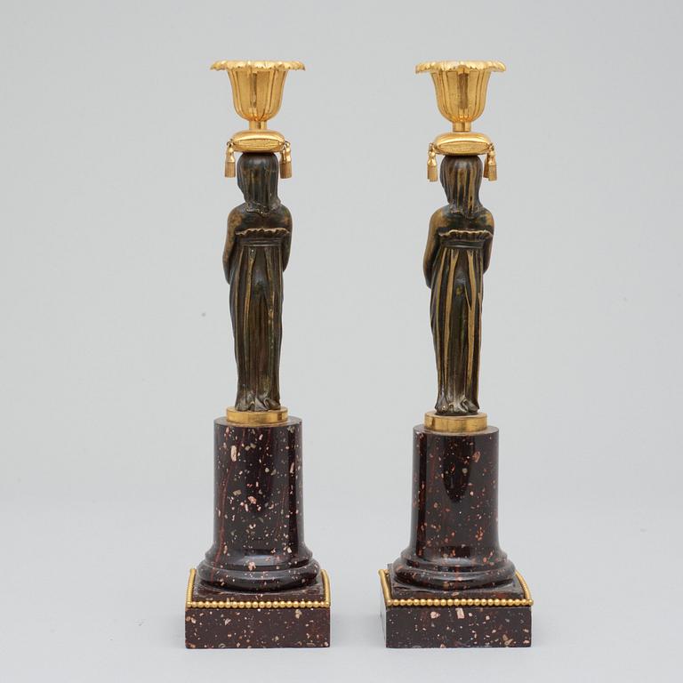 A pair of late Gustavian circa 1800 porphyry candlesticks.