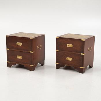 A pair of english style bedside tables from the second half of the 20th century.