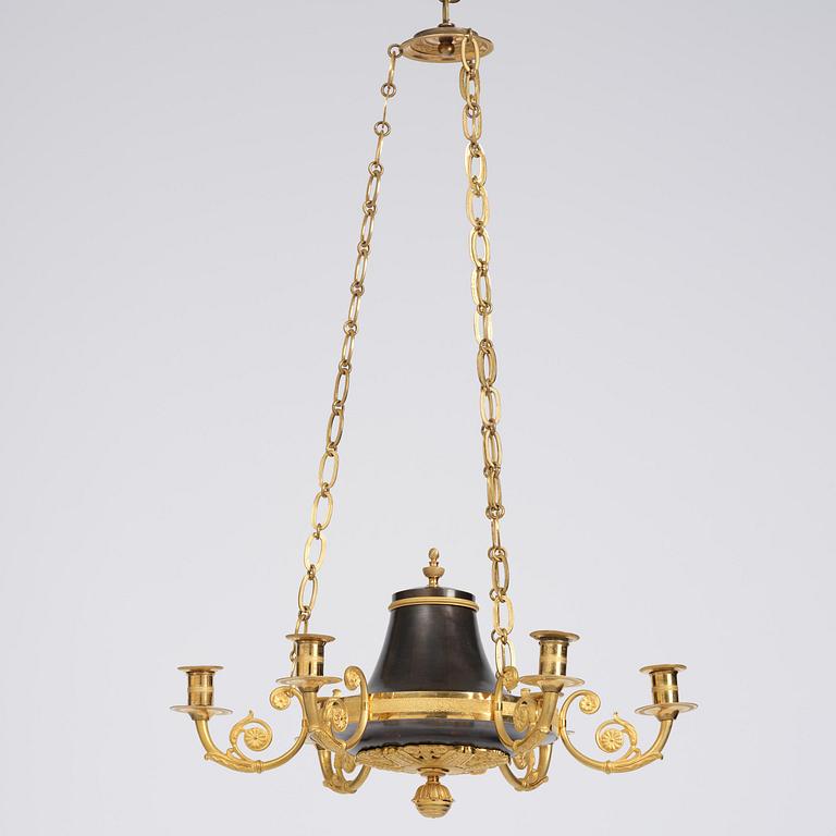A Swedish Empire ormolu and patinated six-branch chandelier, Stockholm, early 19th century.