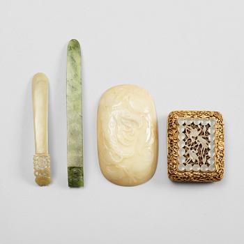 34. Two nephrite hair pins, a placque and a belt-buckle, Qing dynasty (1644-1912).