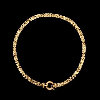 40. NECKLACE, gold with cabochon cut blue sapphire, Italy.